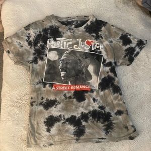 This shirts picture is Tupac. The picture is starting to crack but wont peel.